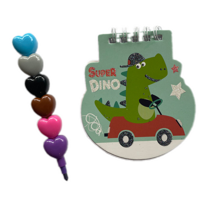 libreta pequeñita para pequeñas obras de arte y un lapiceros de 6 colores intercambiables con monísimas formitas dino