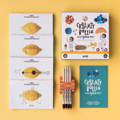 Creativity Battle de Londji es mucho más que un juego de dibujo; es un gimnasio para la imaginación. ¿Qué ves en un simple limón? ¿Un submarino, un ovni o quizás un pájaro amarillo? Este juego creativo de Londji desafía a niños y adultos a mirar más allá de lo evidente.