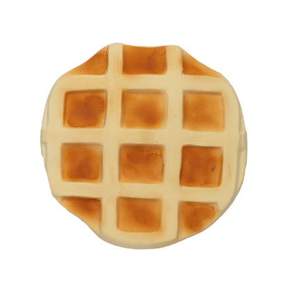 Consigue el mordedor de caucho natural Rafa le Waffle en www.manodesantaoficial.es. Juguete de dentición ecológico, seguro y sin agujeros para bebés, ideal para el baño y el estímulo sensorial.
