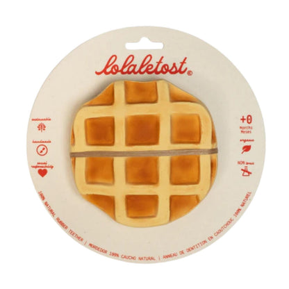 Consigue el mordedor de caucho natural Rafa le Waffle en www.manodesantaoficial.es. Juguete de dentición ecológico, seguro y sin agujeros para bebés, ideal para el baño y el estímulo sensorial.
