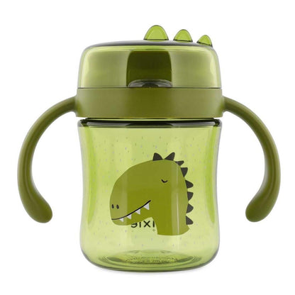 Descubre el Vaso Anti-derrame 360 Dino de Trixie. Taza de aprendizaje con asas en Tritan™ resistente. Ideal para que los niños beban solos sin manchas ni fugas.