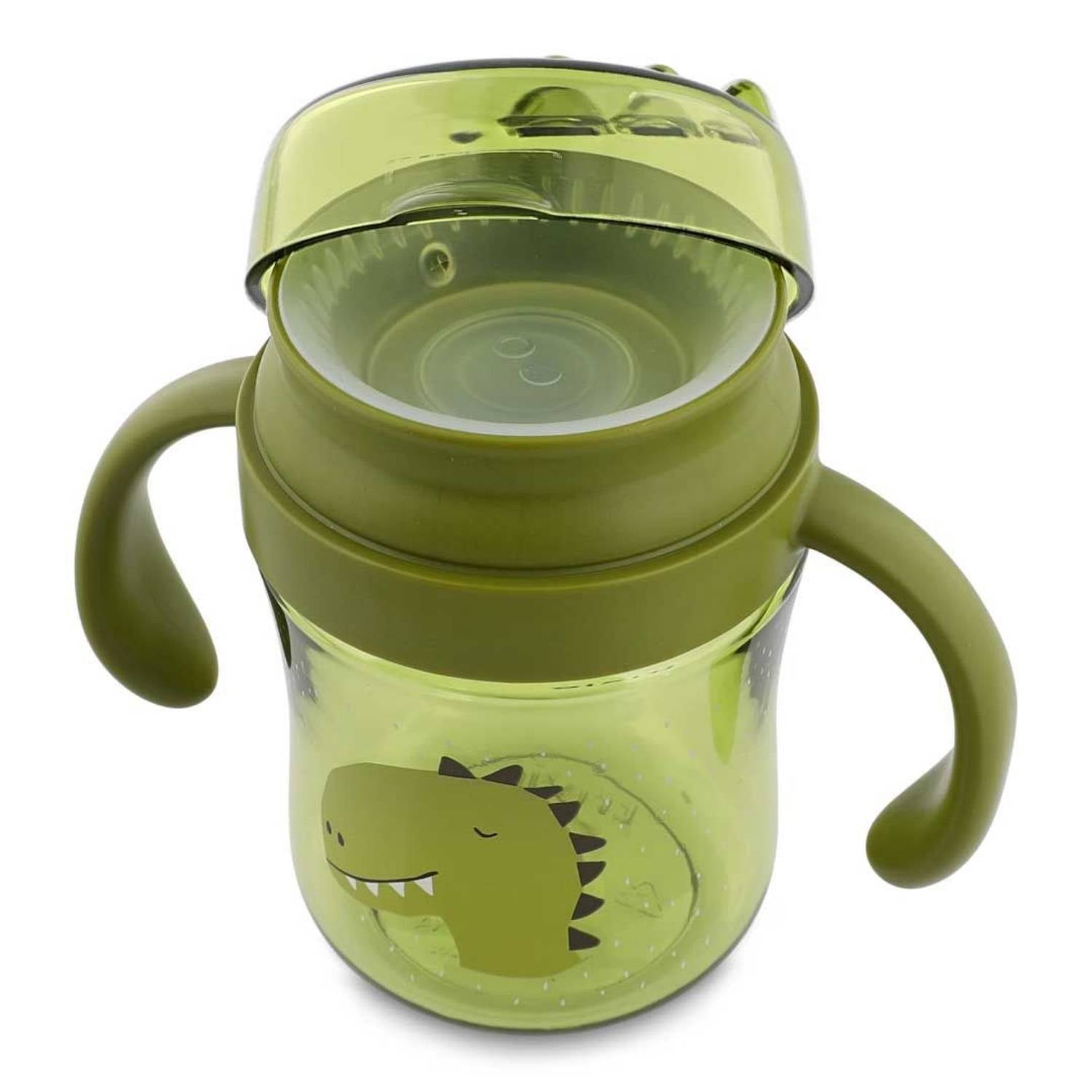 Descubre el Vaso Anti-derrame 360 Dino de Trixie. Taza de aprendizaje con asas en Tritan™ resistente. Ideal para que los niños beban solos sin manchas ni fugas.