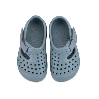 Descubre las zapatillas de agua Malibu Maquillaje, el calzado infantil perfecto para combinar estilo y salud podológica. Fabricadas en E.V.A. de alta calidad, estas cangrejeras destacan por su ligereza y resistencia. Su diseño barefoot medium con cero drop asegura que el talón y la puntera estén a la misma altura, fomentando un desarrollo óptimo del pie