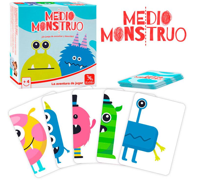 Caja y cartas del juego de mesa medio monstruo con ejemplos de cartas de monstruos a la mitad