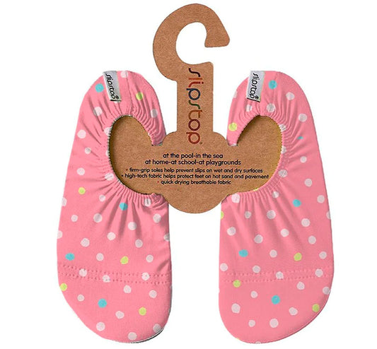 Las Zapatillas antideslizantes LUNARES ROSA Slipstop son escarpines antideslizantes perfectas respetuosas ideales para niños en cualquier situación. Marca Slip Stop