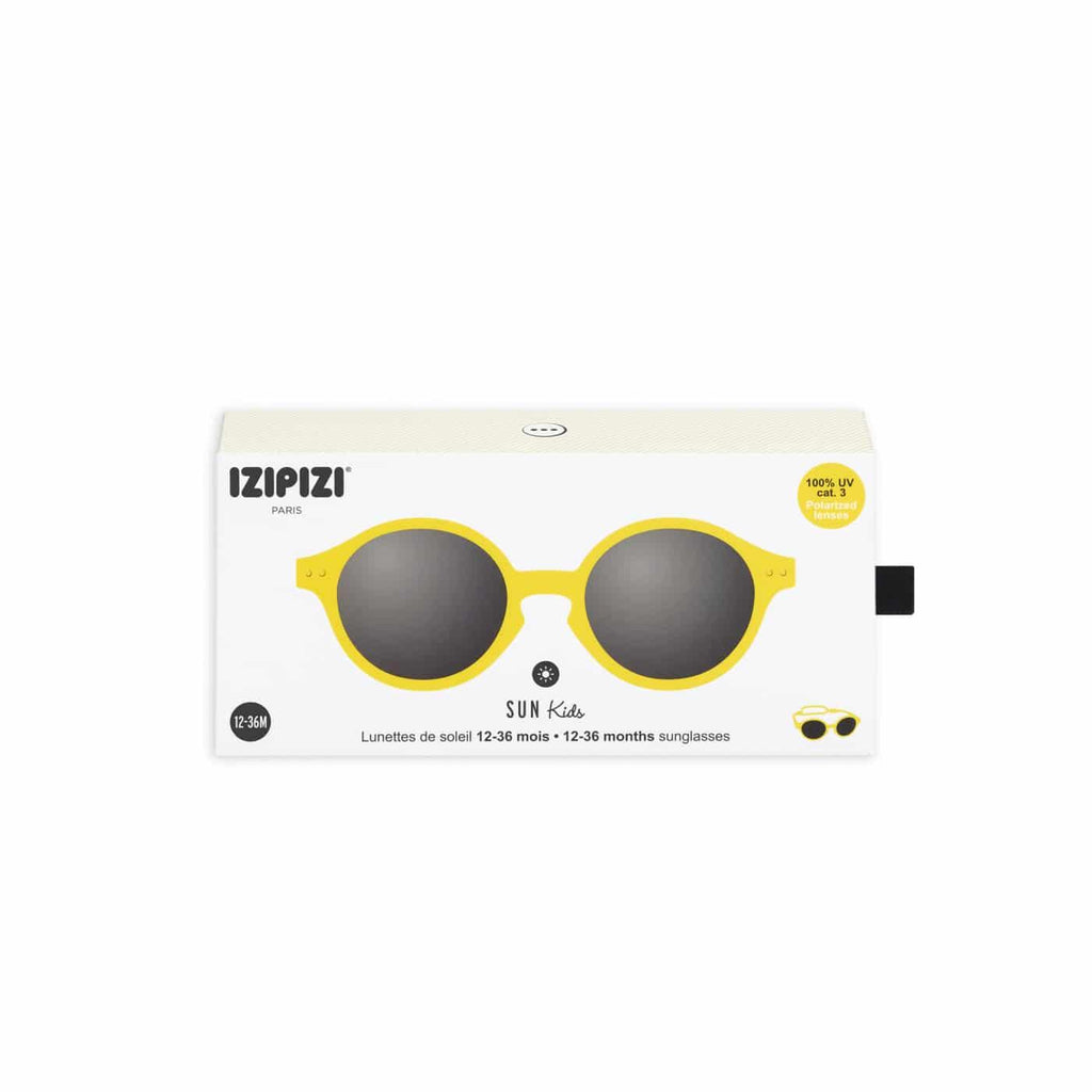 caja de la Gafas de sol infantiles marca izipizi en talla 9-36 meses a, montura modelo d , redondeadas en color amarillo